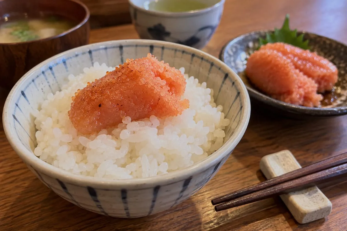 Mentaiko with white rice: A piece of mentaiko on rice, with miso soup, green tea and another plate of mentaiko